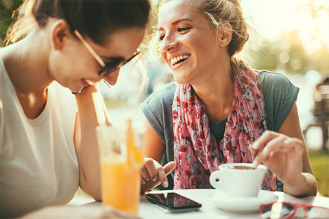 Two friends enjoying lunch together